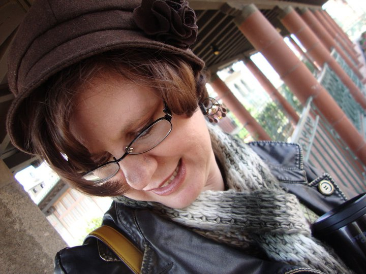 MoJo in Brown hat and matching jacket and scarf.